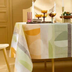 Nappe pur coton enduit 205 g/m² motif jacquard vert orange Mille galets terre cuite