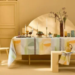 Nappe pur coton enduit 205 g/m² motif jacquard vert orange Mille galets terre cuite
