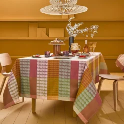 Nappe sur mesure pur coton enduit motif jacquard vert orange Mille halos prunus