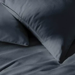 Taie d'oreiller satin de coton motif jacquard bleu Vibrato bleu nuit